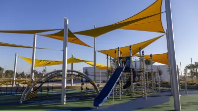 Playground with yellow shade sails and blue equipment in Los Angeles, California