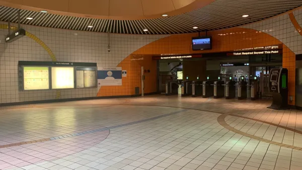 Empty corridor at North Hollywood Metro station with orange and white tiles in North Hollywood, California.