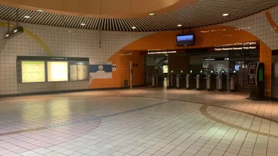 Empty corridor at North Hollywood Metro station with orange and white tiles in North Hollywood, California.