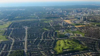 An aerial view of Mississauga, Ontario, with Lake Ontario in the background.
