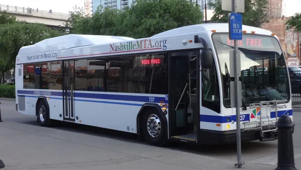 Nashville MTA transit bus at station on street.