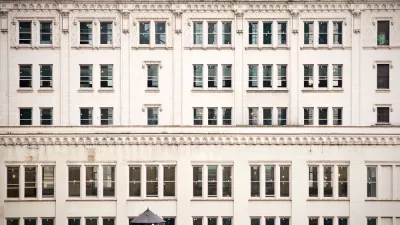 A closeup of rows of buildings lined by old fashioned windows in New York City.