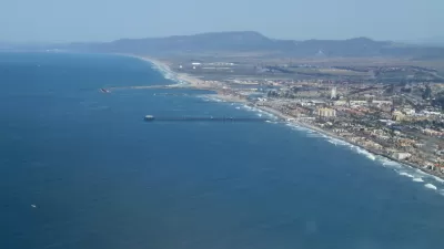 An aerial photo of the Oceanside Pier in Oceanside. The Oceanside Marina is also visible.