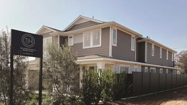Grey two-story home rebuilt in Pacific Palisades, Los Angeles after 2025 wildfire.