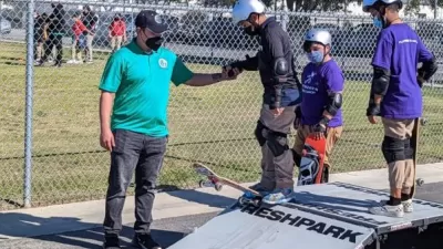 Children learning to skateboard