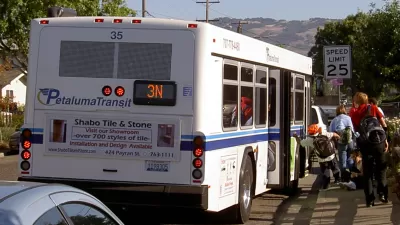 Passengers boarding a Petaluma Transit bus.