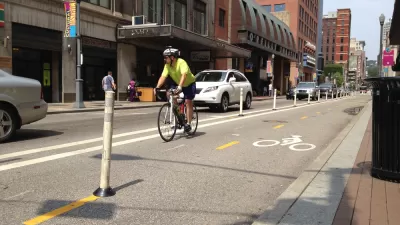 Cyclist riding on a downtown Pittsburgh bike lane