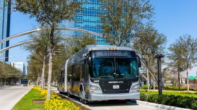 Silver Houston Metro bus on dedicated lane.