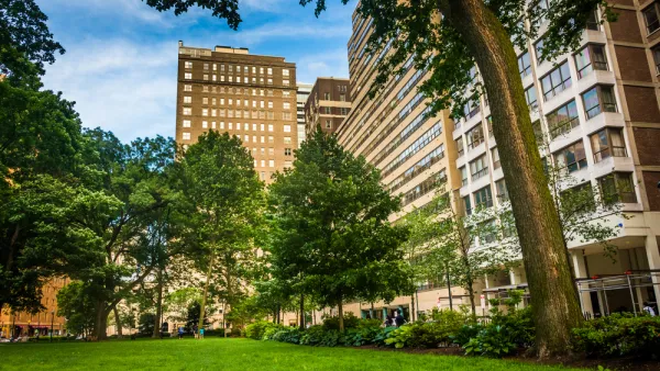 Rittenhouse Square, a park in Philadelphia, framed by large buildings. 