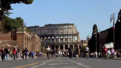 Colosseo in Rome as seen from Via dei Fori Imperiali on a Sunday when traffic is cut off.