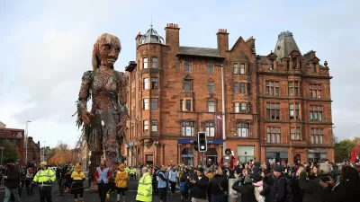A giant puppet of a sea goddess made entirely of recycled materials walked through Glasgow during the COP26 climate change summit.