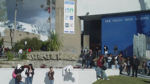 Front of San Diego High School with students milling around.