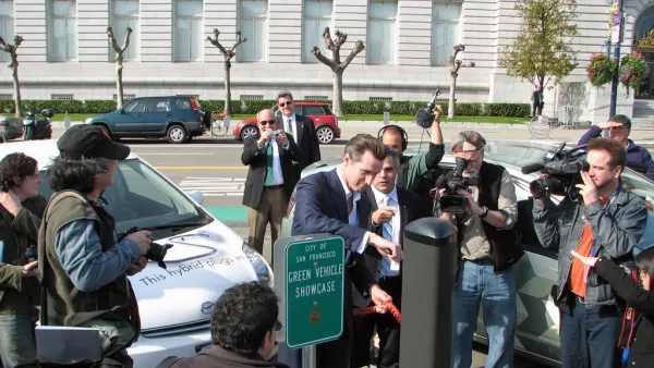 Mayor Newsom sees how easy it is to plug in as Coulomb Technologies CEO Richard Lowenthal looks on at Debut of San Francisco's new Plug-In Charging Stations in front of City Hall (Green Vehicle Showcase)