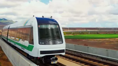Rendering of white Honolulu light railtrain speeding past landscape