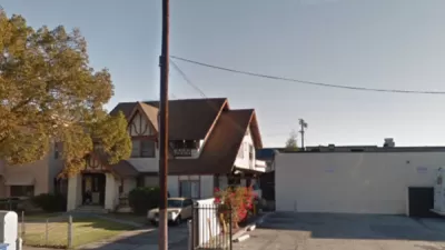 Google street view of late Victorian home in Harvard Heights neighborhood of Los Angeles, with one-story commercial building next door.