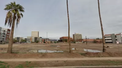 Google street view of vacant lot in Phoenix, Arizona with palm trees in foreground