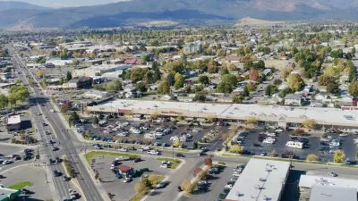 Aerial view of midtown Missoula, Montana with mountains in background