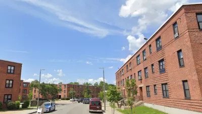 Google street view of brick three-story public housing buildings in Dorchester, MA.