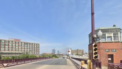 Google street view of wide bridge over Chicago River with small brick towers at corners.