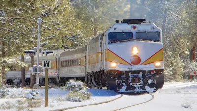 Train passing through a snowy landscape.