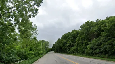 Google Street View of wide roadway flanked by green trees in Milwaukee, Wisconsin.