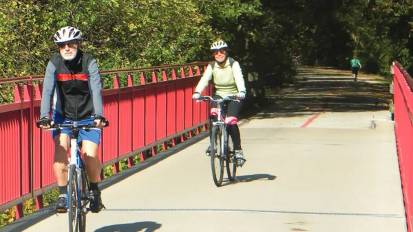 People riding bike son paved greenway in Indianapolis, Indiana.