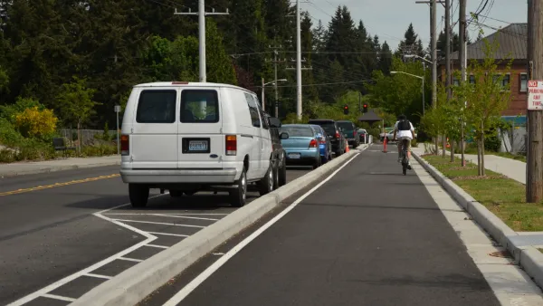 Cyclist rides in protected bike lane in Jacksonville, Florida.