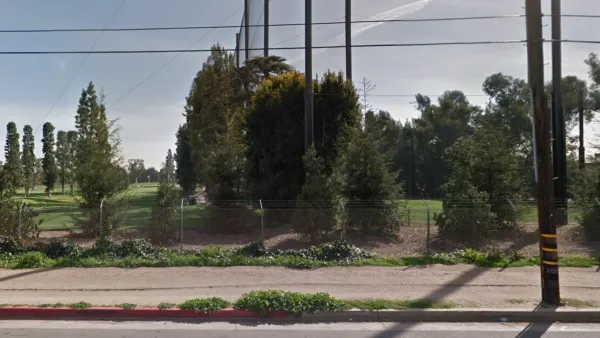 Barbed wire fence in front of golf course in Brentwood, Los Angeles, CA.