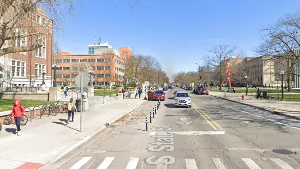 Street view of State Street in Ann Arbor, Michigan with protected bike lane.