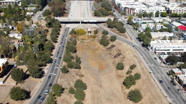 Aerial view of vacant land at end of 710 freeway in Pasadena, California framed by roads on either side.