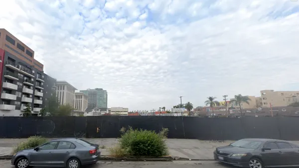 Google street view of vacant lot behind construction fence in Koreatown, Los Angeles, California.