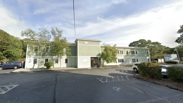 A long, green building that is the proposed location of the Catholic Charities of the Diocese of Fall River's new shelter.