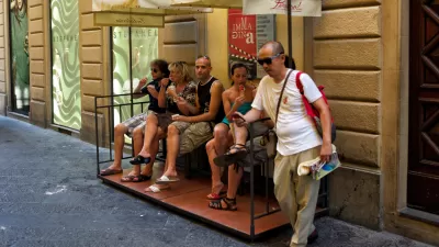people eating ice cream on sidewalk seating