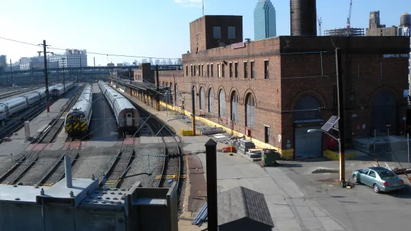 Brick buildings next to railyards.