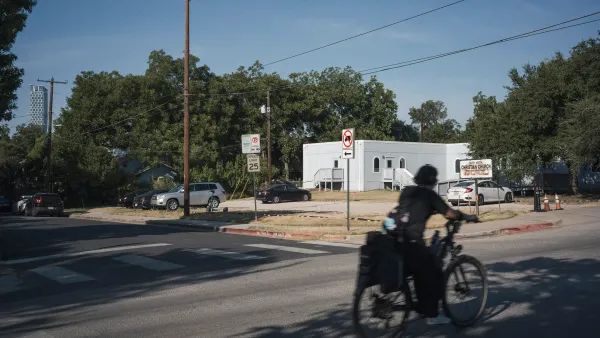 A bike rides by a church lot