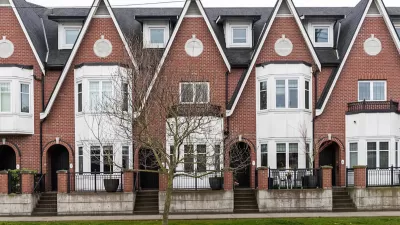 Row of brick three-story townhomes in Britih Columbia.