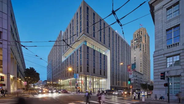Modern multistory residential building, part of UC Law school in downtown San Francisco at dusk.