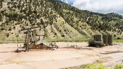 An oil well in a mountainous and remote part of Utah.