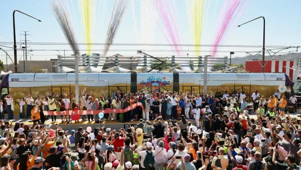 Crowd gathered at train station for grand opening of South Central Extension/Downtown Hub in Phoenix, Arizona.