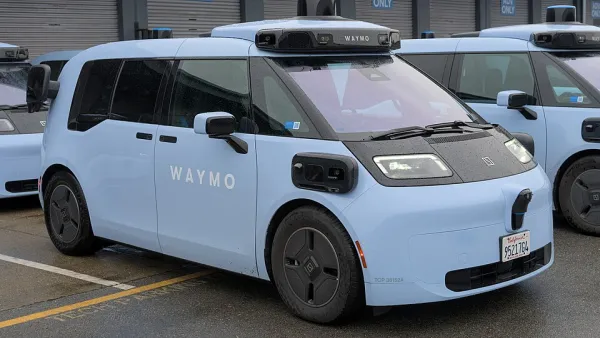 A light-blue Ojai vehicle. The car's design resembles a mini van.