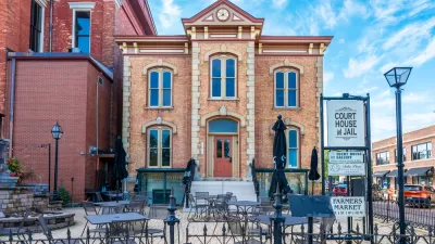 A street view showing the historic courthouse and jail in Woodstock, Illinois.