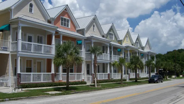 Row of colorful two-story houses close to each other in Ybor City, Florida.