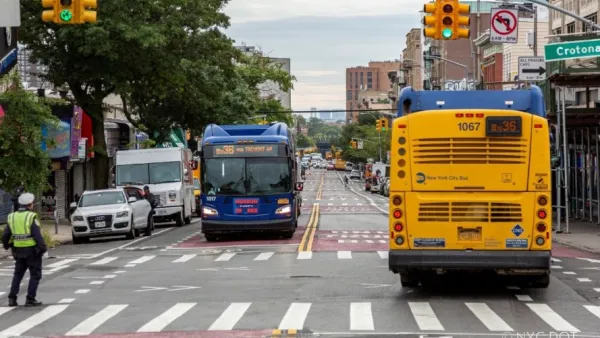 The new busway. The pavement is painted red, indicating it as a bus-only lane.