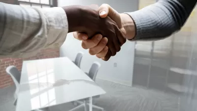 Close-up of a handshake in an office