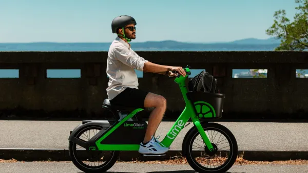 Man riding LimeGlider green shared mobility pedal-less e-bike/scooter hybrid.
