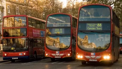 The fronts of three double-decker buses in London