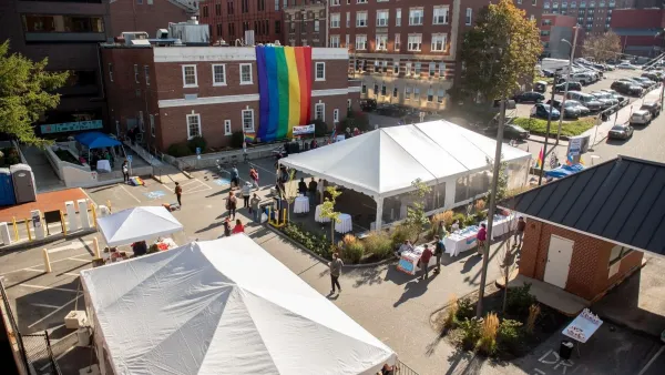 A large pride flag hangs over the Equality Community Center.
