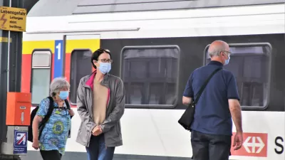 Masked Passengers at Rainway Station