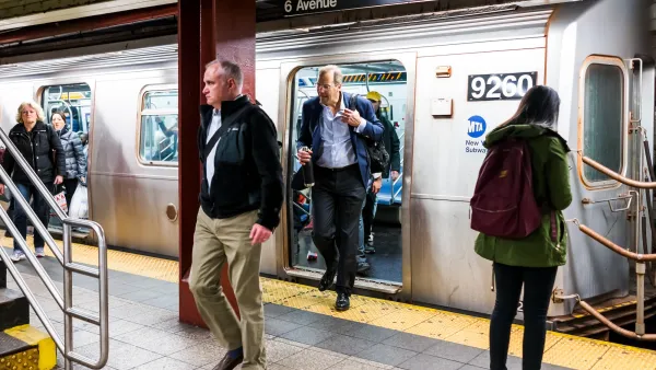 Passengers entering and exiting a New York City subway train at an underground station.