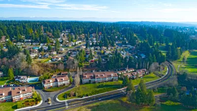 Aerial view of Edmonds, Washington with road in foreground and buidings surrounded by trees